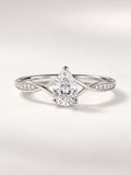 Bague Infini — diamant poire créé en laboratoire sur anneau croisé pavé, or blanc — vue de face